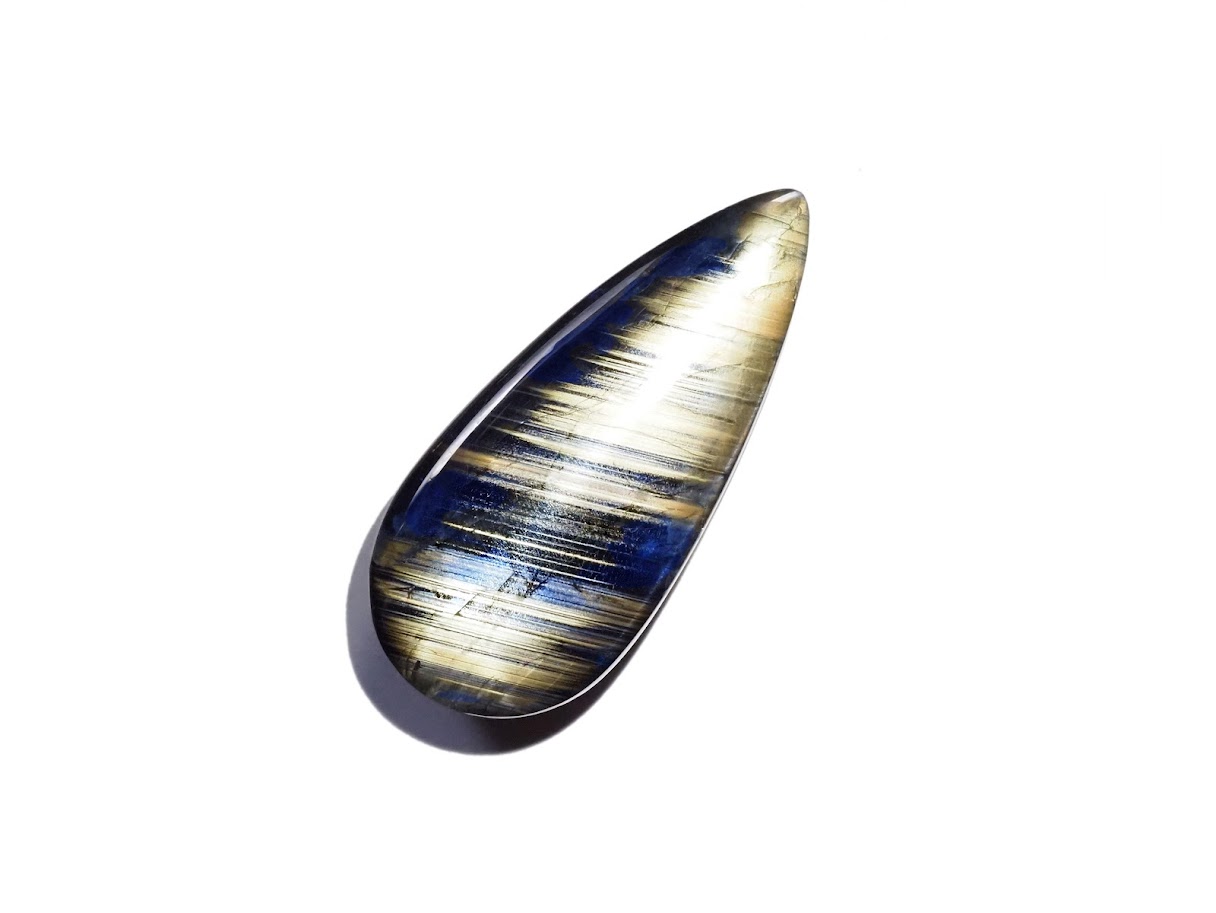 Polished gold sheen sapphire cabochon, teardrop cut, blue and gold banding